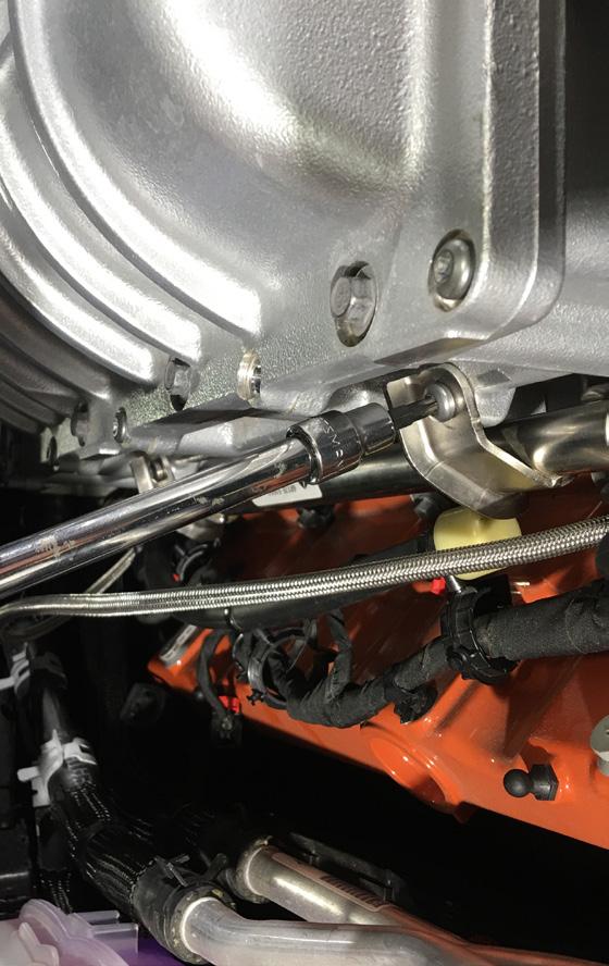 Step 23: Secure the fuel injector rail by tightening the 2
