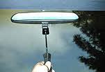 After the adhesive has set, attach the mirror assembly and tighten the set-screw carefully to not damage the windshield.