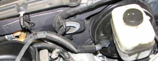 Disconnect the vacuum hose from the fuel