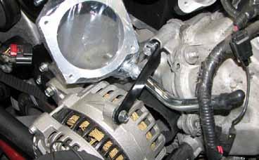 122. Thread the serpentine belt through the alternator bracket and over the alternator pulley before securing the alternator to the bracket with the two M8 x