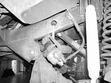 Disconnect the inner tie rod end from the pitman arm and remove the pitman arm with a pitman arm puller and discard, save hardware.