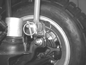 Picture shown with coilover bumpstop spacer REAR SUSPENSION INSTRUCTIONS: 45. Jack up the rear end of the vehicle and support the frame rails with jack stands just in front of the rear bumper.