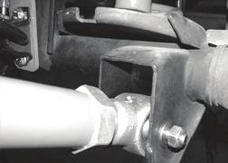 Axle Mount Shown With Grease Fitting Facing Up 70. Repeat steps sixty-seven through sixty-nine on the passenger side of the Jeep 71. Locate the upper bump stops cups, remove and discard.