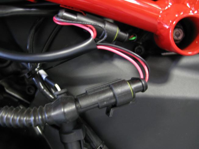 4. Next, locate the factory speed connectors, found on the right side of the bike near the oil filler cap and attached to the bottom of the frame rail.