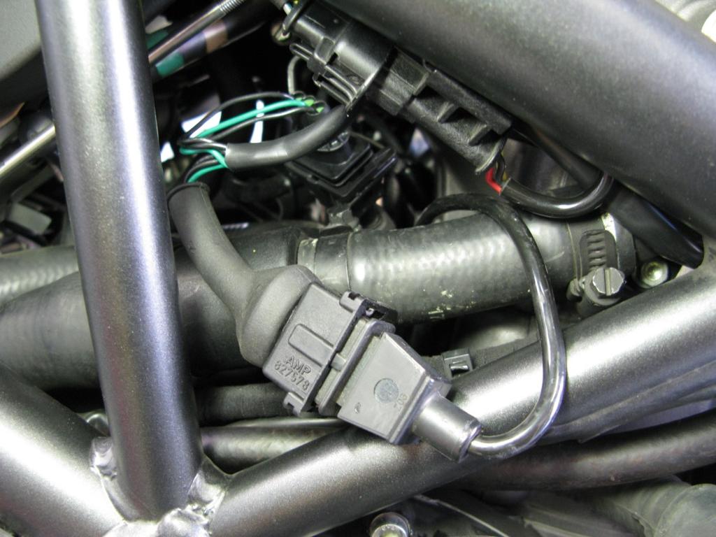 Locate the Crank Position (CPS) connectors (found between cylinders below air box).