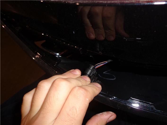 Remove the bumper fascia by removing () T-0 Torx bit screws () from the trunk () from