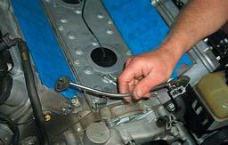 Remove the coolant vent pipe by removing the attachment bolts