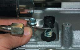 With the throttle body bolted to the inlet manifold, carefully rotate the PCV barb forward and down using a