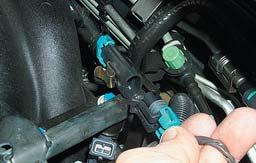 17. Remove the clamp and then the coolant line from the side