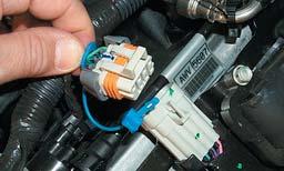 21. On both sides of the engine disconnect the ignition coil