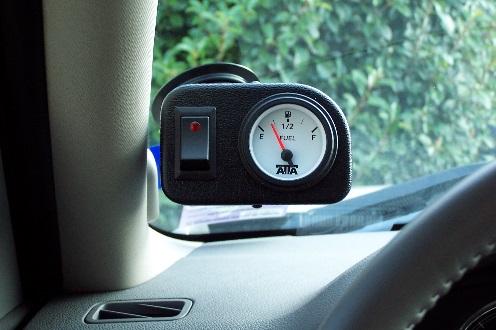 1. Mount the Gauge & Switch Console on desired location on dash. Note: Attach locking suction cup to console arm to mount on windshield. Clean surface area to insure proper seal of suction cup.