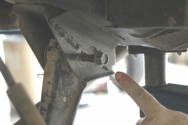 Lower the axle and remove the coil spring. A coil spring or strut compressor may be needed to remove the stock coil. Pull the ABS sensor wire from the stock mount.