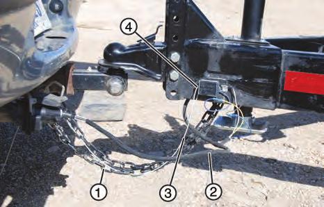 9. Attach safety chains (1) securely to the tow vehicle to prevent unexpected separation. Cross the chains when attaching. 10. Connect wiring harness (2) for the lights and brakes. 11.