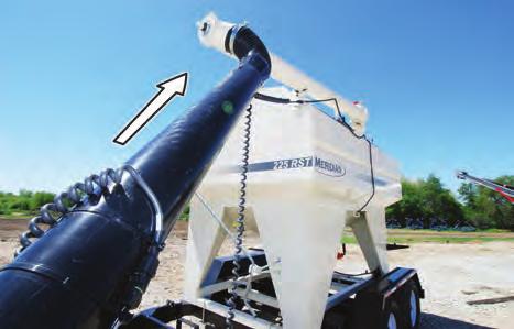 7. Raise the auger tube by pushing it upward, using the delivery spout.