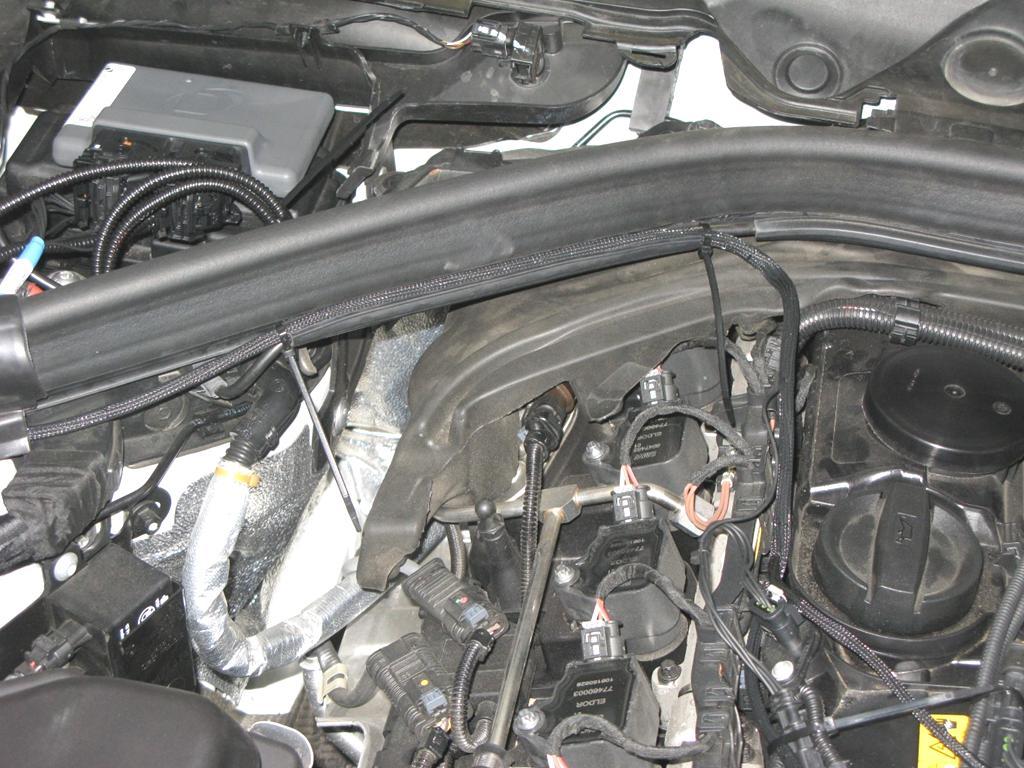 11. Once all connectors on the engine have been plugged in, we will now place multiple zip-ties throughout to secure the DINANTronics harness to the vehicle.