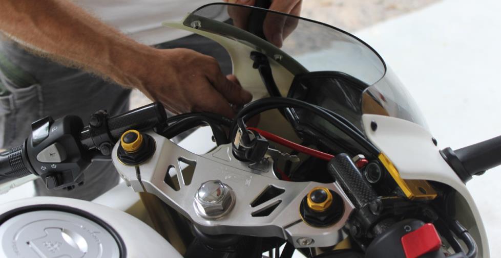 they tend to touch the fairing when the handlebars are on full lock by rotating the throttle cable downwards towards the front brake