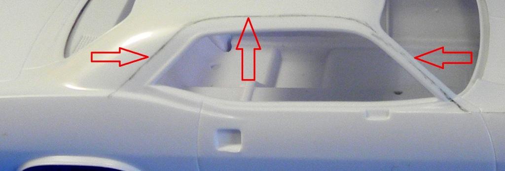 [fig 7] Next there are mold/seam lines on both sides of the roof that run just above the windows. For the most part these were easily sanded off with the stick, but not when it came to the front part.