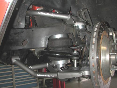 Installation Instructions 1. After removing the factory lower control arm, clean the bushing mounting surfaces on the frame. 2.