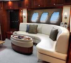 A gracious, full-beam master stateroom features handcrafted wood trim, a queen-size bed, extra-large windows, and an elegant dresser with beveled mirror and pullout