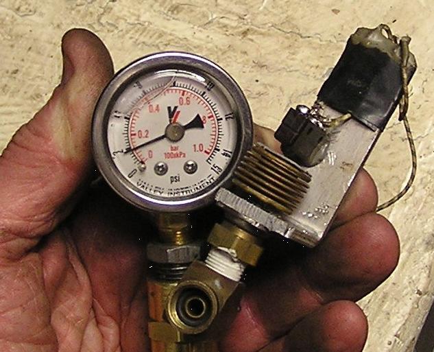 When I test for pressure I simply disconnect one carb s supply line and put the gauge on that pipe. Starting the engine allows a few minutes of idle-time to make the reading.