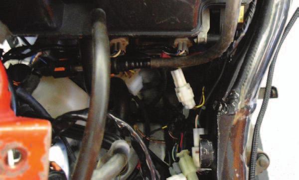 The pair of PCV leads with ORANGE colored wires go in-line of the cylinder #1 (left-most) fuel injector.