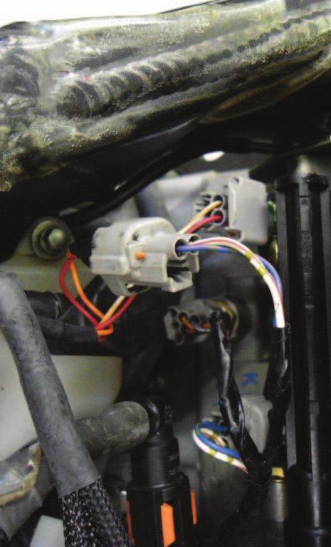 The pair of PCV leads with GREEN colored wires go in-line of the cylinder #3 fuel injector.