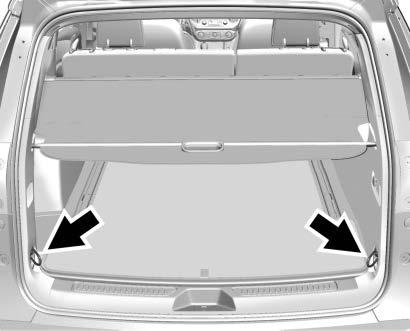 Unroll the cover toward the rear of the vehicle. Insert the cover pins into the channels on both sides.