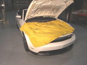 Note: As a precautionary measure, add a second layer of tape around opening to reduce the risk of scratching the hood.