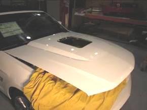17. Remove tape from hood.