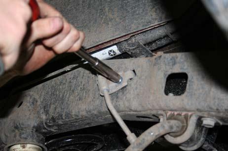 Remove the bracket that holds the park brake cables to the body using a 10mm deep well socket. 5. 6.