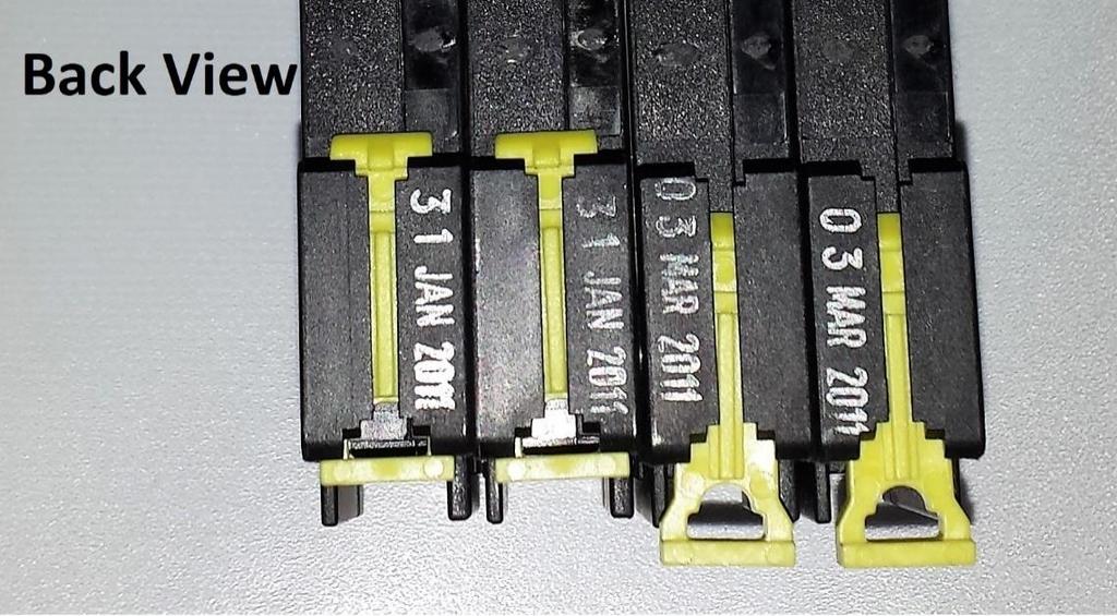 NOTE: Before installing the circuit breakers, disengage (pull straight down) the yellow din rail tabs on the back of the breakers using your fingernail or a small, straight-slot