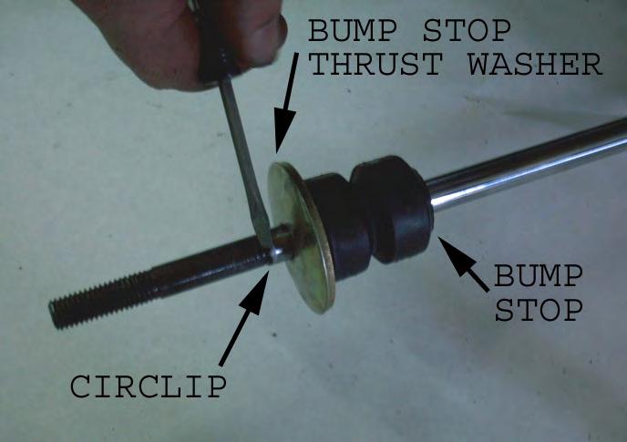 With the spring removed, raise the control arm into place and reinsert the pivot bolt and torque to 111 lb-ft.