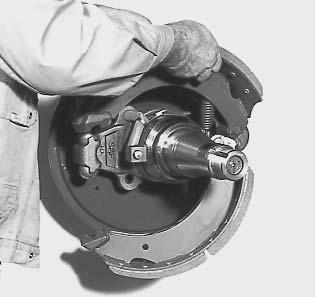 a vice. Apply copper paste to the brake shoes, to the ball surface and to the two journals of the cam roller.