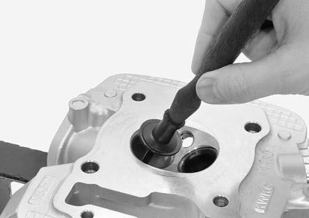 TOOL: Valve guide driver 07942-8920000 CYLINDER HEAD/VALVES While the cylinder head is still heated, take off the new valve guides from the freezer and install new clips to the new guides.