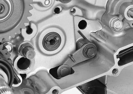 Pull the gearshift spindle out of the crankcase being careful not to damage the oil seal lip, and remove the thrust