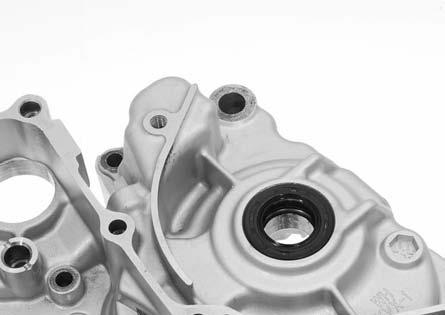 Carefully separate the left crankcase from the right crankcase while tapping them at several locations with a soft hammer.