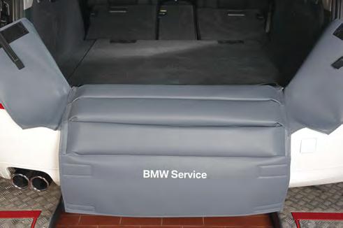 Made of strong foam-coated artificial leather, grey. With imprint of the BMW Service logo to support the Rear end Size: about 152 x 78 cm Weight: about 2.