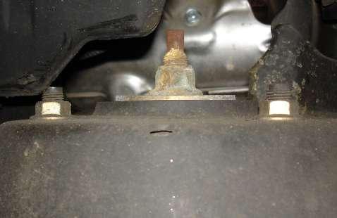 Separate the steering arm tie rod taper from the spindle. 8. Support the lower control arm. 9.