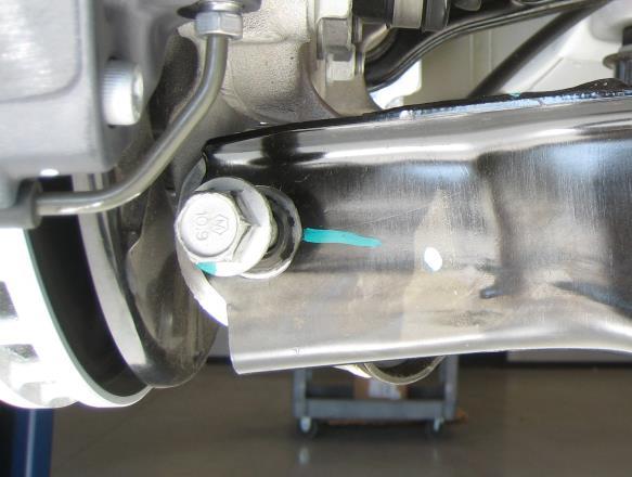 Secure the knuckle to the lower control arm using the OE bolt and nut, but do not tighten at this time.