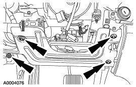 10. Loosen the two driver-side instrument panel tunnel brace bolts. Position the carpet aside to gain access to the bolts. 11. Remove the screws and the steering column opening reinforcement. 12.