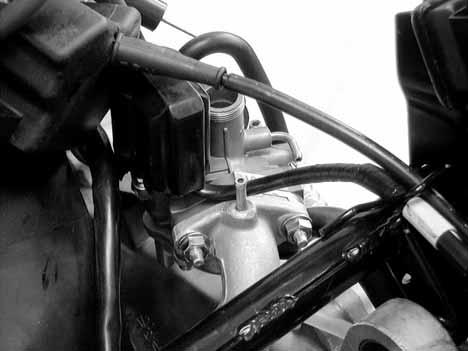 Remove the two carburetor lock nuts. Remove the carburetor and carburetor insulator.