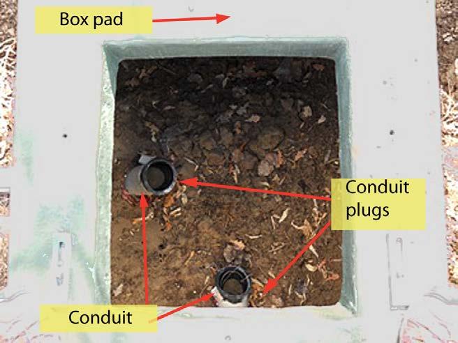 6.3.5. Conduit Placement The box pad sits on properly compacted soil. The conduits enter under the box pad. Do not attempt to enter the box pad through the side by making a hole in the fiberglass.