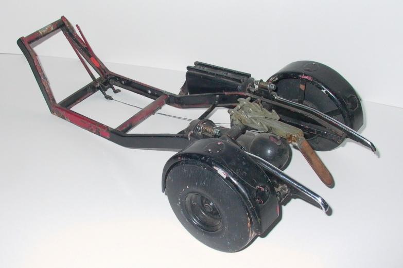 With the chassis stripped my thoughts turned to making a new front wheel assembly; the model had been used as a toy when it was found in a garden and the front wheel/steering unit plus the driver's