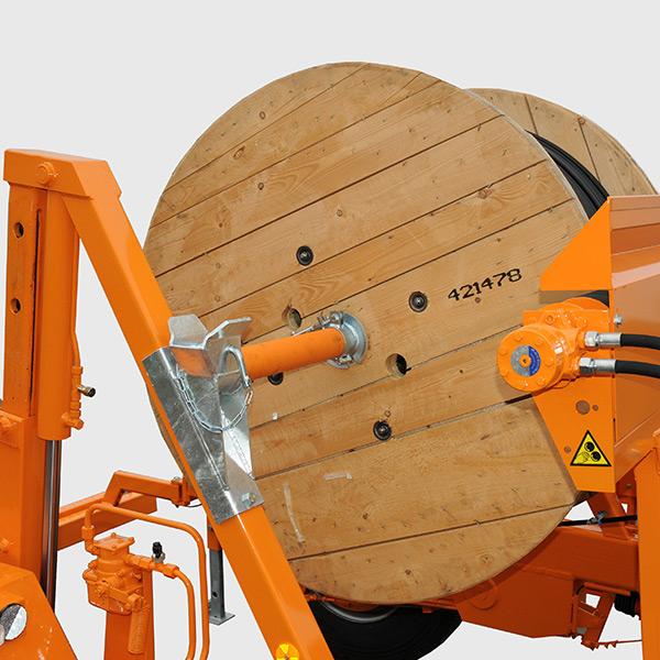 Drums are vertically lifted for transport by two hydraulic jacks operated by central hand pump or by motorized hydraulic which can also drive the drum, as an accessory.