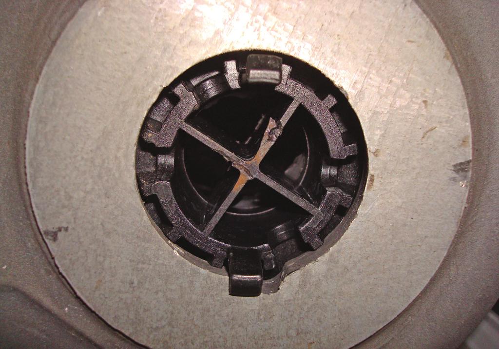 Air Lift 1000 4. Once the hole is created; in order to make access to the barb on the cylinder it will be necessary to remove the cross ribs from the lower spring retainer (fig. 3).
