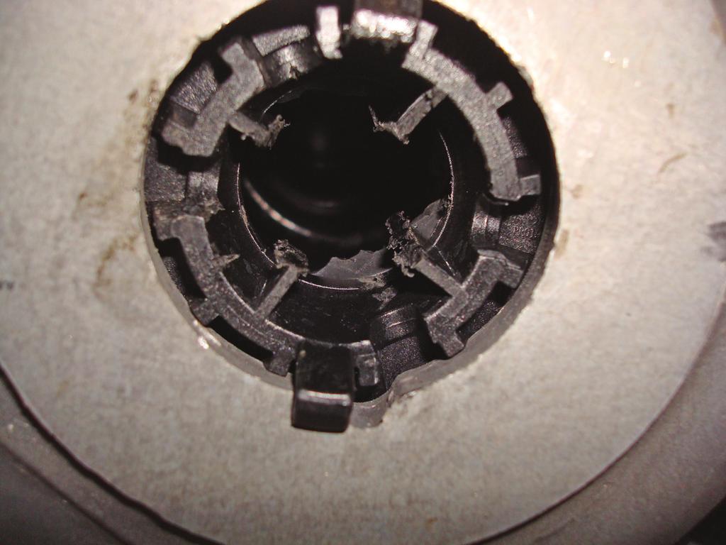 To do this you can use a hack saw blade (or anything comparable) and cut each rib out creating access in the center of the lower spring seat, to the cylinder that will be installed (fig. 4).