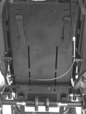 With the mounting height for the upper harness straps established, peel the top of the backrest upholstery forwards away from the Velcro pads.