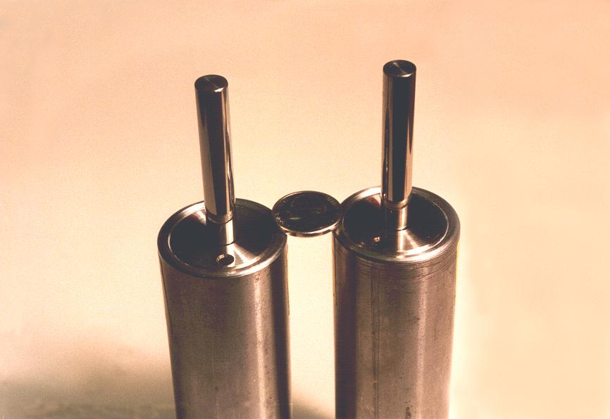 PHOTO 2 These are 2 pieces of a Model 6232 Fluid Spring-Damper. This model is a standard Taylor product which is still in production today.