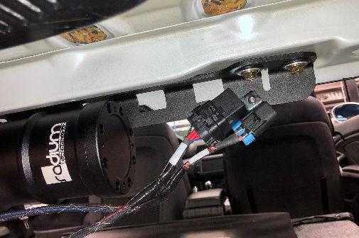 Connect the OEM feed line to this fitting, pushing until it "clicks". Reinstall the bolt for the fuel tank strap. Make sure the fuel lines are not being pinched before tightening the bolt.