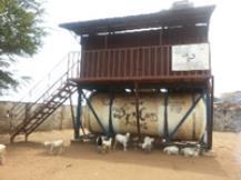 Picture 2: Picture of a faecal sludge temporary transfer station, with a community latrine directly on top As a means of improving on the quality of compost, a compost bay structure was constructed